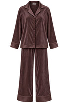 A two-piece pajama set in a  brown ribbed plisse fabric, featuring a long-sleeve button-front top with a collar and matching wide-leg pants, shown on a plain white background.