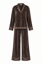 A two-piece pajama set in dark brown corduroy fabric with matching satin trim, featuring a long-sleeve button-front top and wide-leg pants, shown on a plain white background.