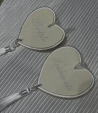 Two heart shaped personalised charms for brides and bridesmaids 