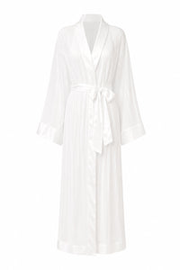 A white long-sleeved silk robe with a shawl collar, tie belt, and subtle vertical pleats, shown against a plain white background.